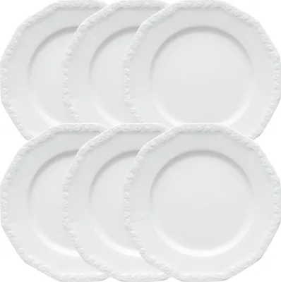 A set of six white Rosenthal dinner plates stacked in two rows.