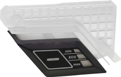 A close-up view of a control panel and a white plastic grate.