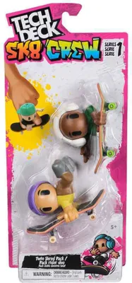 The image shows a blister pack of Tech Deck Sk8 Crew toys, featuring two miniature skateboarders and their skateboards.