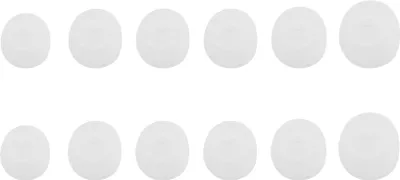 A grid of 12 white earbud tips, arranged in two rows of six.