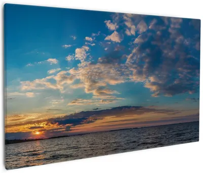 Produktbild von Wallario Premium Leinwandbild Sonnenuntergang über einem Fluss in Größe 60 x 90 cm