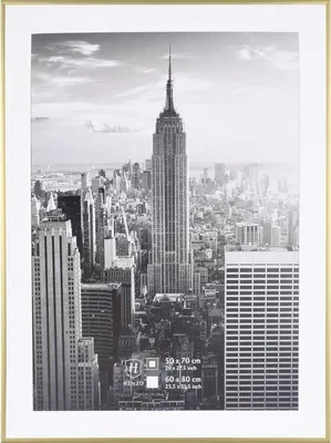 A framed black and white photograph of the Empire State Building and the New York City skyline.