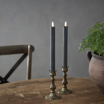 Immagine prodotto di Candele a bastoncino LED a fiamma - cera vera - LED bianco caldo tremolante - h: 25cm - timer - nero - set di 2