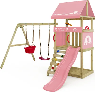 A children's wooden play structure with pink accents, including a slide, swings, and a climbing wall, set against a white background.