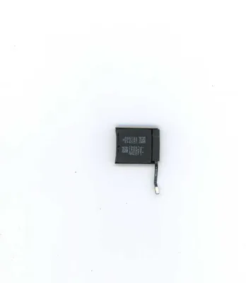A small black battery with a thin cable attached, lying on a white background.