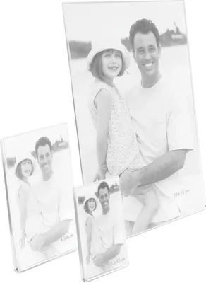 Three photo frames of varying sizes are displayed, with the largest frame in the background showing a man holding a young girl.
