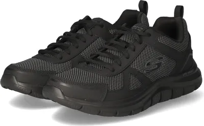 A pair of black Skechers sneakers is shown from a slightly elevated side angle against a white background.