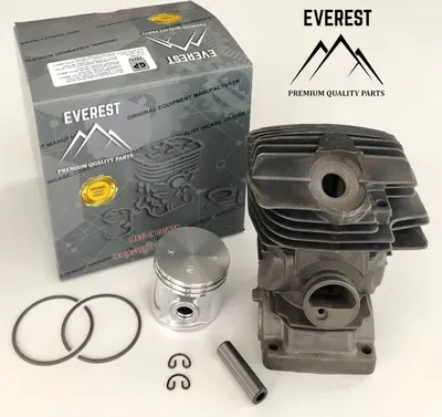 A chainsaw cylinder and piston kit is displayed on a white background, with its packaging box visible.