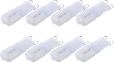 A top-down view of eight white LED light bulbs arranged in two rows of four.