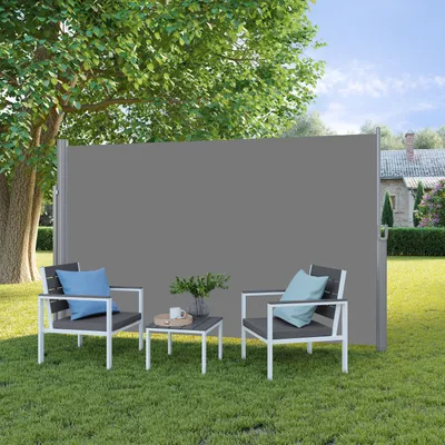 A patio scene with two chairs, a small table, and a retractable side awning.