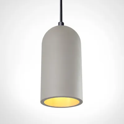 A pendant light with a concrete-gray finish and a yellow interior.