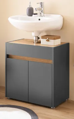 A bathroom vanity cabinet with a sink mounted above it.