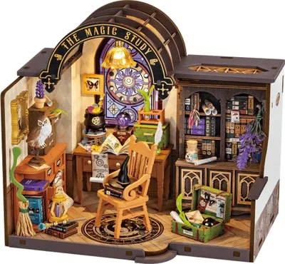 A miniature 3D wooden puzzle of a magic study, complete with furniture, books, and magical items.