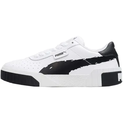 A side view of a white Puma sneaker with black accents.