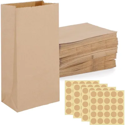Immagine prodotto di Sacchetti di carta marroni piccoli, confezione da 100 pezzi, con etichetta, in carta kraft, ideali per calendari dell'Avvento, matrimoni, compleanni, dimensioni 9x18x5,5 cm