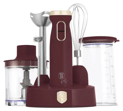 A set of kitchen appliances including an immersion blender, whisk, chopper, and measuring cup, arranged on a charging base.