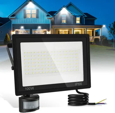 A floodlight with a motion sensor is shown in the foreground, with houses illuminated by floodlights in the background.