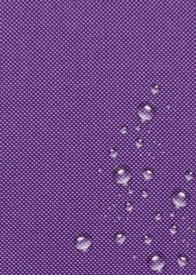 A close-up view of a purple fabric with water droplets on it.