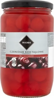 A jar of cocktail cherries on a white background.