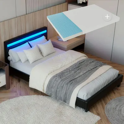 A bedroom scene featuring a bed with LED lighting and a mattress overlay.