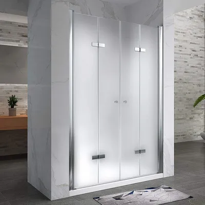 A modern bathroom with a frosted glass shower door.