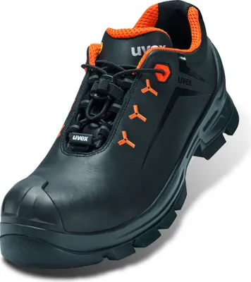 A studio shot of a single black safety shoe with orange accents.