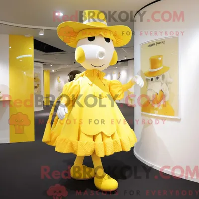 Produktbild von Maskottchen REDBROKOLY einer zitronengelben Kuh mit A-Linien-Kleid und Baskenmütze