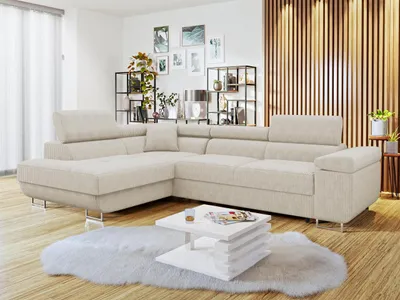 A modern living room with a sectional sofa, coffee table, and decorative shelves.