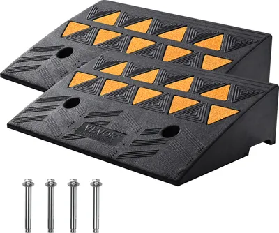 Two black rubber ramps with orange triangular patterns are shown on a white background, along with four metal bolts.