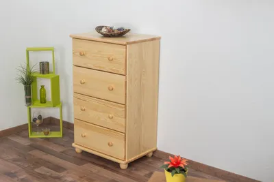 A wooden chest of drawers is shown in a room with a green shelf unit and a potted plant.