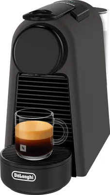 A black De'Longhi Nespresso Essenza Mini coffee machine with a cup of espresso.