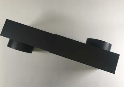 A black adjustable duct elbow is shown on a light gray background.