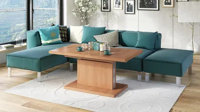 A modern living room with a teal sectional sofa and a wooden coffee table.