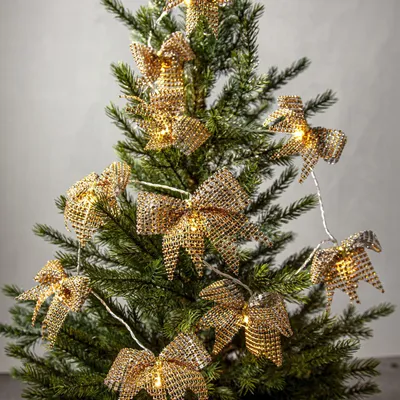 Immagine prodotto di Ghirlanda luminosa decorativa a batteria «Bowie», 20 fiocchi in tessuto dorato, LED, timer, luce bianco caldo, L 200 cm