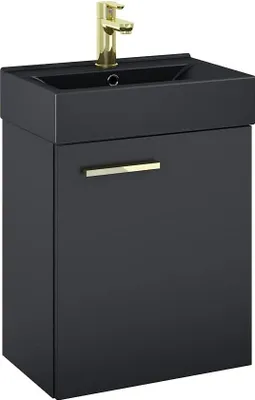 A black bathroom vanity with a sink and a gold faucet.