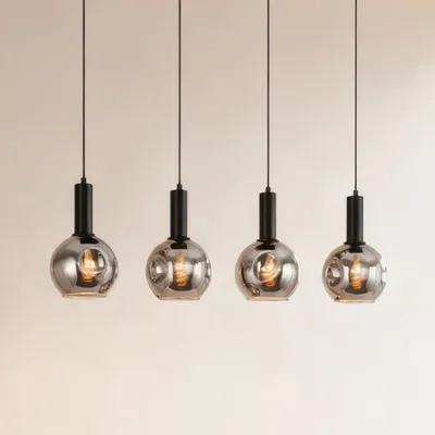 Produktbild von home24 Pendelleuchte - Gusseisen / Rauchglas - Schwarz - 4-flammig