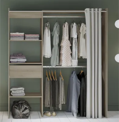 A wardrobe with clothes hanging and folded on shelves.