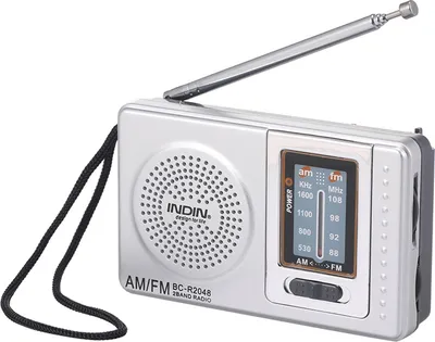 A silver portable AM/FM radio with an extended antenna and a black lanyard.