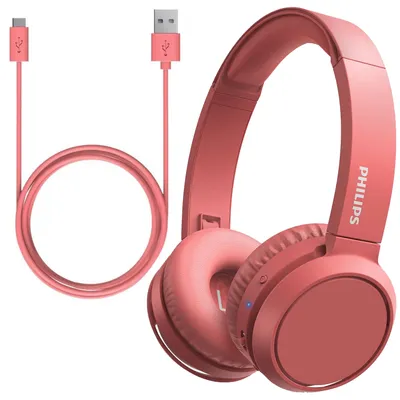 A pair of red Philips headphones with a charging cable.