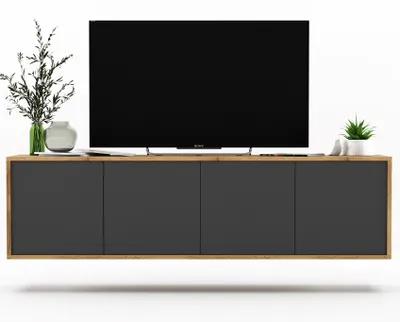 A modern TV cabinet with a television and decorative items, presented against a white background.