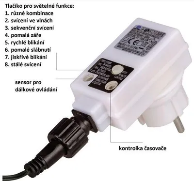A close-up of a white electrical adapter with a black cable attached, showing text labels and regulatory marks.