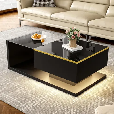 A modern living room scene featuring a black coffee table with a glass top, illuminated by LED lights, placed on a rug in front of a cream-colored sofa.