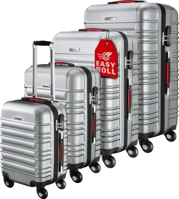 A set of four silver suitcases of varying sizes, arranged diagonally.