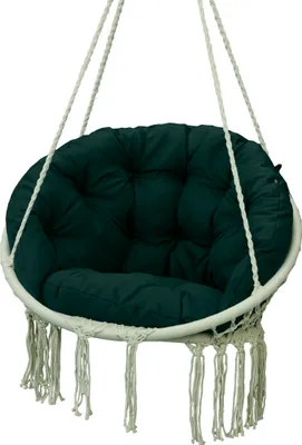 A hanging chair cushion with fringe detail.
