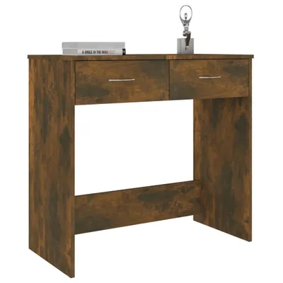 A wooden desk with two drawers and a decorative item on top.