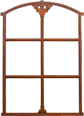 A rusty metal window frame with an arched top and decorative elements.