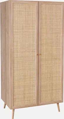 A wooden wardrobe with rattan doors on a white background.