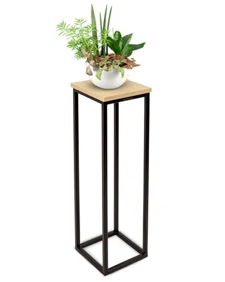 A decorative stand with a potted plant on top, set against a white background.