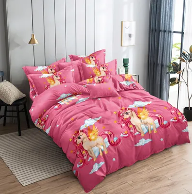 A pink unicorn-themed duvet cover and pillowcases are neatly arranged on a bed.