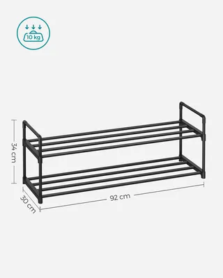 A black, two-tiered shoe rack with dimensions indicated.